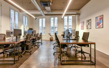 Modern office space rental at Prins Hendrikkade 48 A, Amsterdam Center, featuring sleek workstations, ergonomic chairs, and ambient lighting. Ideal for professionals seeking a comfortable and productive work environment.