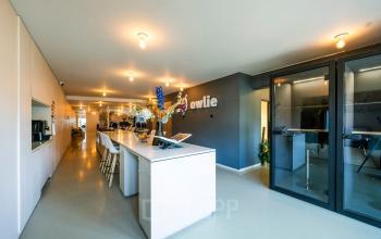 Modern interior of an office space with sleek design at Groenmarktkade 5-H, Amsterdam Center. Features include spacious seating, vibrant decor, and ideal for office space rental.