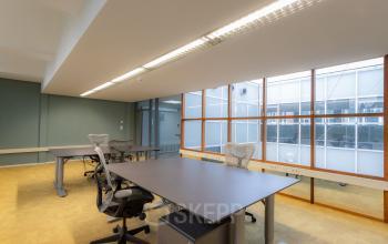 Office space at Kerkstraat 204 in Amsterdam Center featuring modern desks and ergonomic chairs, ideal for productivity and comfort in a spacious setting. Perfect for those seeking office space rental in a central location.