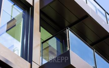 Modern exterior with glass balconies at Pieter Cornelisz. Hooftstraat 7, offering office space rental opportunities in Amsterdam Center.