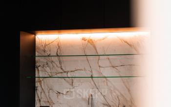 Modern interior space with marble accents and sleek design at Pieter Cornelisz. Hooftstraat 7 7, perfect for office space rental in Amsterdam Center. The clean lines and minimalist style offer a professional environment.