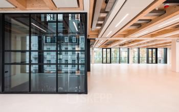 Spacious office space rental in Amsterdam Center, featuring large windows and modern design, located at Pieter Cornelisz. Hooftstraat 7. Ideal for businesses seeking an open work environment.