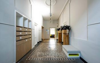 Spacious interior hallway at Rapenburgerstraat 173, featuring modern decor and ample storage, ideal for office space rental in Amsterdam Center.