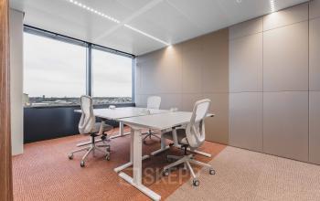 Bright office space with modern furnishings at Piet Heinkade 55, offering a panoramic view, ideal for those seeking office space rental in Amsterdam Center.