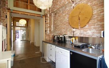 Chic office space rental at Warmoesstraat 149 - 151 in Amsterdam Center with exposed brick walls and modern amenities.
