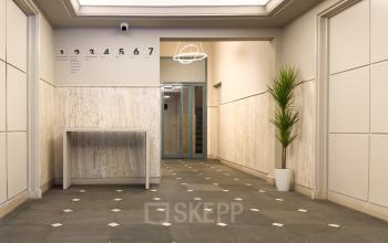 Interior view of an office entrance at Kleine Gartmanplantsoen 21, Amsterdam Center, highlighting the minimalist design ideal for those seeking office space rental.