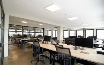 Spacious office to rent in Amsterdam Center with modern furnishings and ample natural light, perfect for collaborative workspaces.