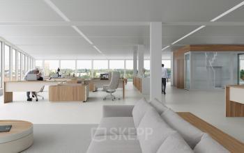 Modern office space with large windows, contemporary furniture, workstations, and people working at desks at Rijnsburgstraat 9-11 in Amsterdam De Schinkel.