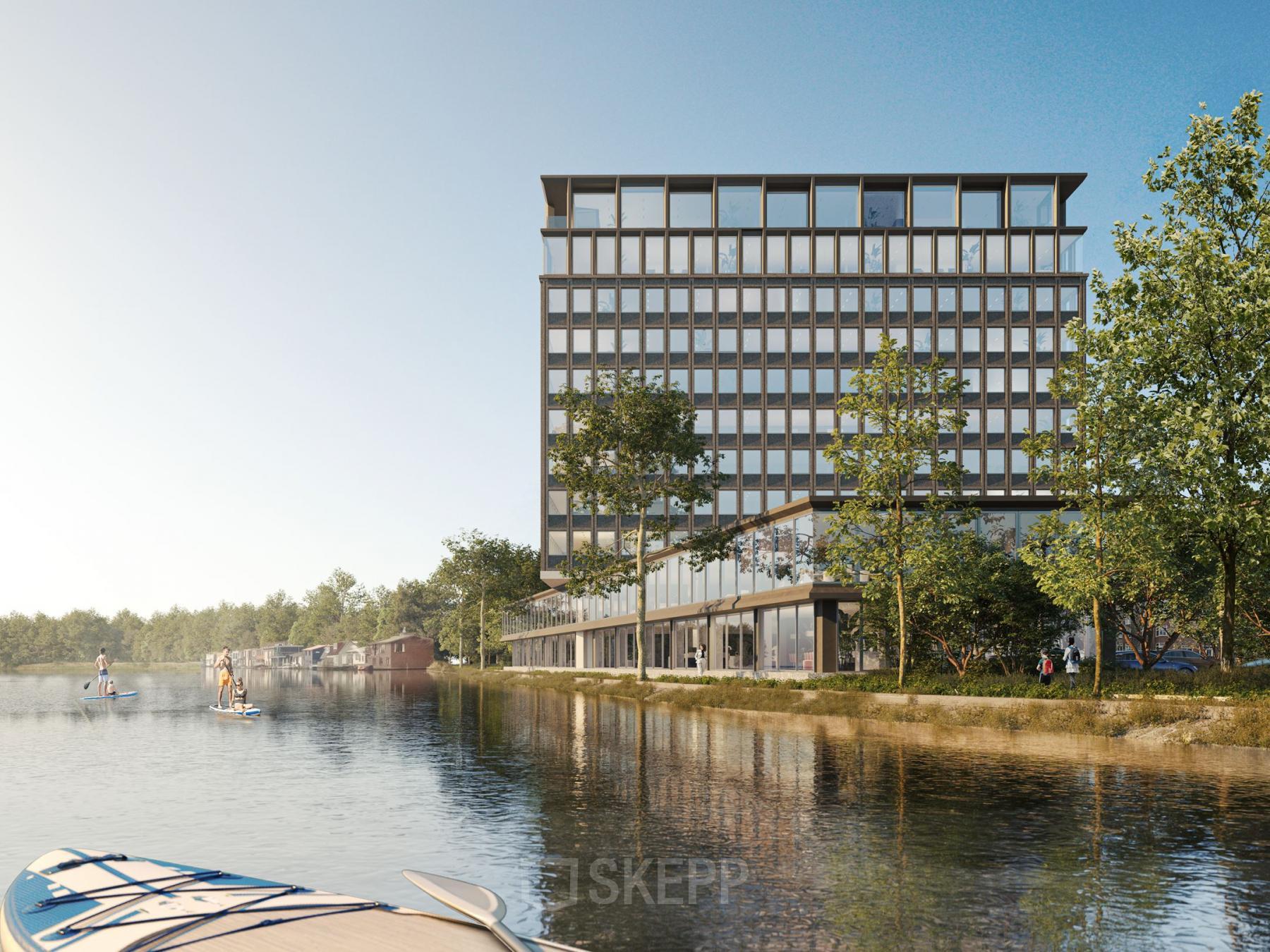 Exterior view of office building at Rijnsburgstraat 9-11, Amsterdam De Schinkel, with modern architecture next to a waterfront.