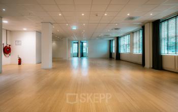 Spacious office to rent at Overschiestraat 182, Amsterdam De Schinkel with wooden flooring and ample natural light.