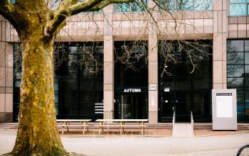 Exterior view of Overschiestraat 182, an office to rent in Amsterdam De Schinkel. The building features large windows and a welcoming entrance.