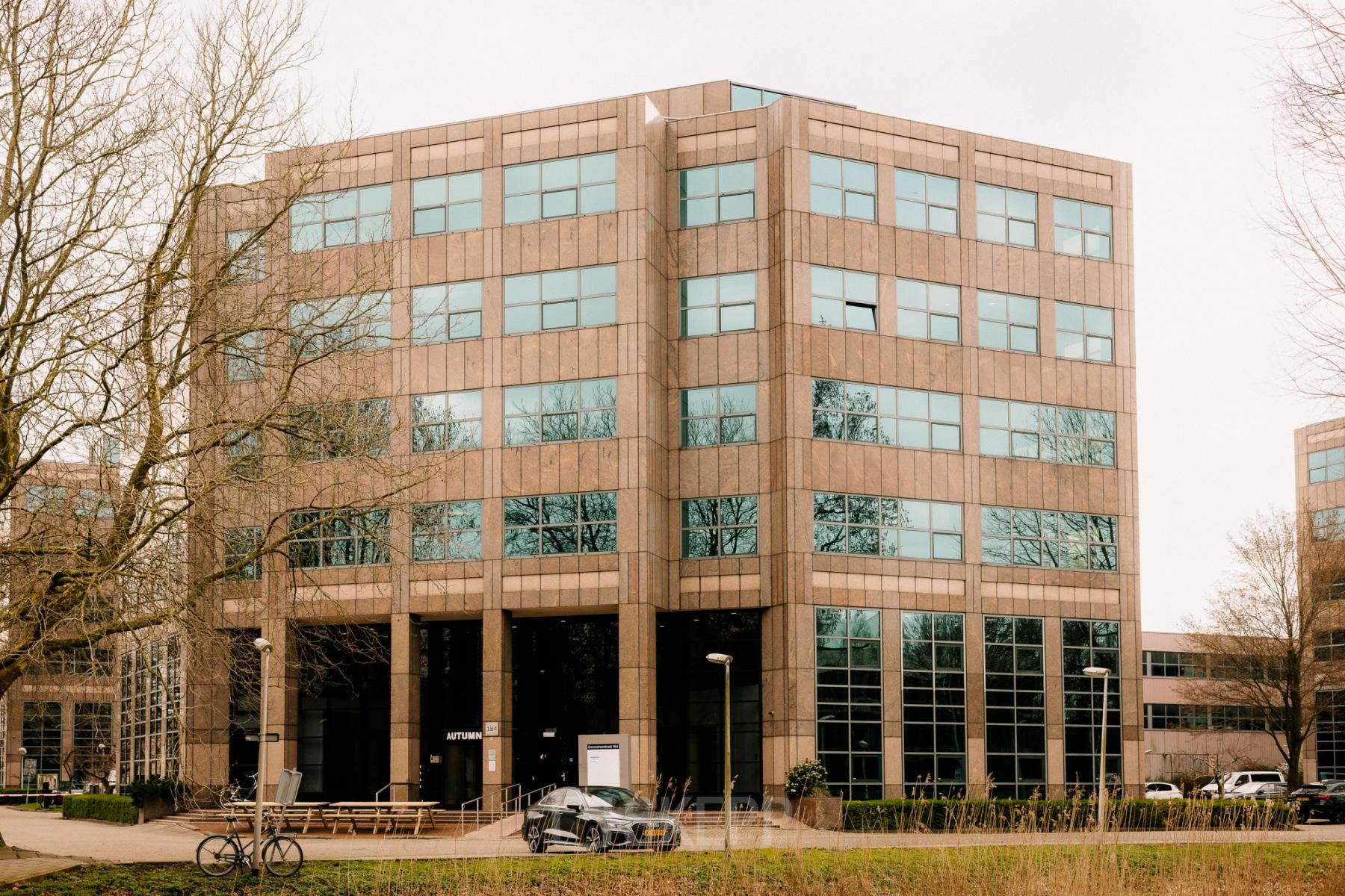 Exterior view of office building at Overschiestraat 182, Amsterdam De Schinkel, showcasing large windows and modern design, ideal for office space rental.