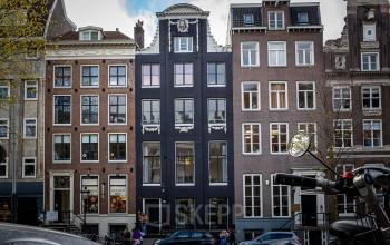 Exterior view of the office building located at Herengracht 420 in Amsterdam Canal Belt, Amsterdam, featuring classic Dutch architecture.