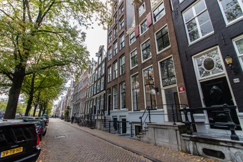 Street view of Keizersgracht 62-64 in Amsterdam Canal Belt, showcasing classic canal-side architecture.