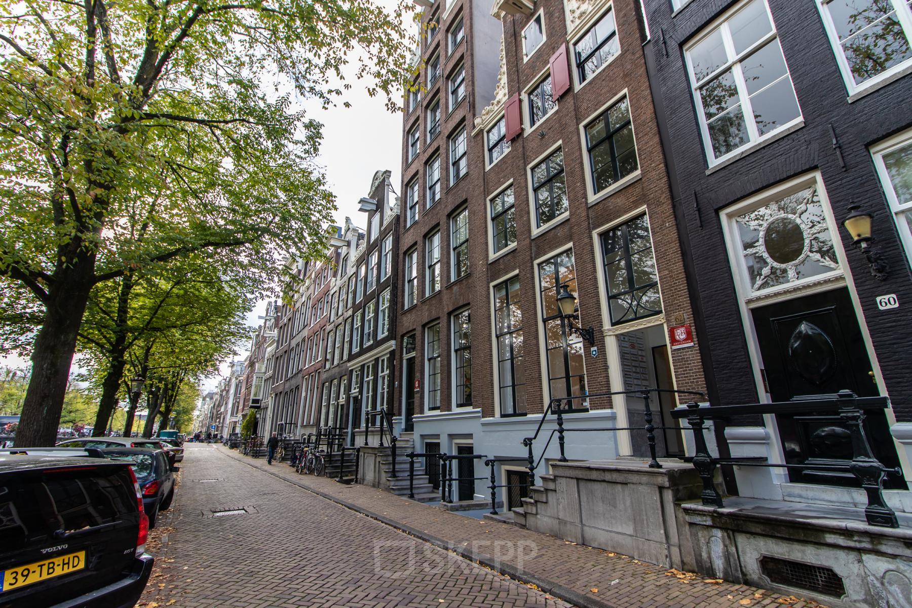 Street view of Keizersgracht 62-64 in Amsterdam Canal Belt, showcasing classic canal-side architecture.