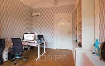 Elegant office space rental at Herengracht 282 with modern furnishings and patterned wallpaper, Amsterdam Canal Belt ambiance.