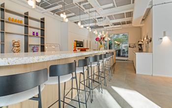 Chic and modern pantry area with bar stools and sleek interior lighting, located in the Amsterdam Canal Belt at Keizersgracht 572 572, perfect for office space rental.