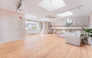 Bright, open-floor office space with skylights and hardwood floors, located in the Amsterdam Canal Belt, perfect for rent office space.
