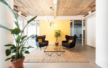 Cozy furnished office space with modern decor available for rent at Singel 542, Amsterdam Canal Belt.