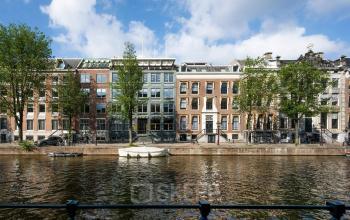 Charming view of historic buildings along Herengracht 459-469 in Amsterdam's Canal Belt, ideal for an office space rental with picturesque surroundings.