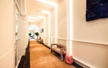 Bright hallway with designer bench and modern lighting at office to rent on Keizersgracht 264, Amsterdam Canal Belt.