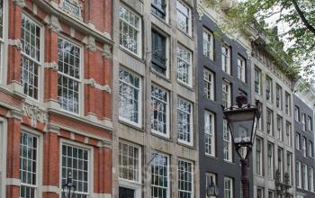 Exterior view of offices at Herengracht 168 in the Amsterdam Canal Belt, showcasing charming historical architecture suitable for office space rental.