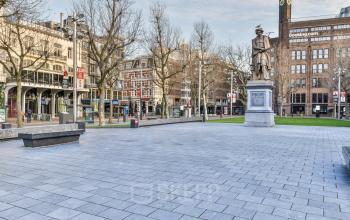 Amstel 62 office space rental in Amsterdam Canal Belt, overlooking a bustling square with historic charm.
