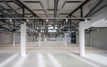 Spacious office interior at Van Diemenstraat 20-200, Amsterdam Houthavens, with modern industrial design. Ideal for office space rental.