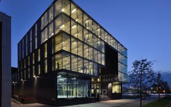 Modern office building at Moermanskkade 109-113, Amsterdam Houthavens, featuring large glass windows and a sleek design, perfect for office space rental.