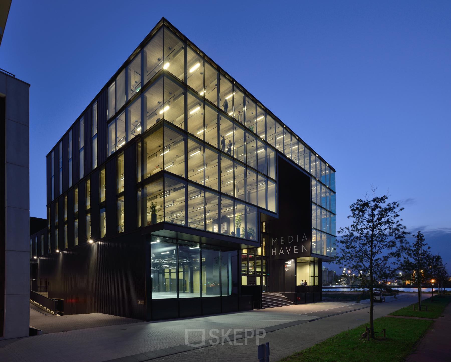 Modern office building at Moermanskkade 109-113, Amsterdam Houthavens, featuring large glass windows and a sleek design, perfect for office space rental.