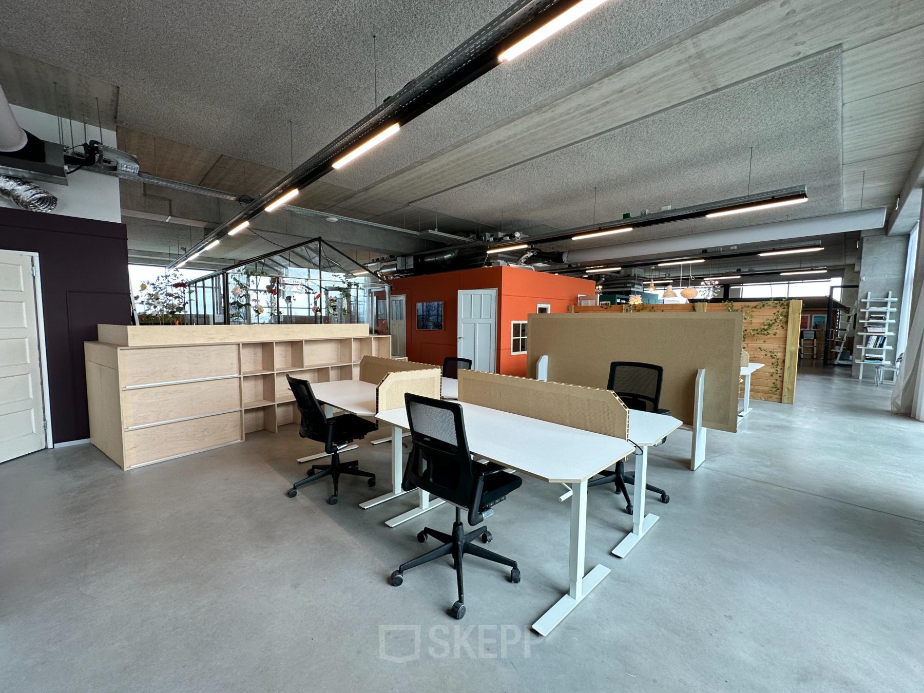 Open office space for rent at Danzigerbocht 39 in Amsterdam Houthavens, featuring modern desks, ergonomic chairs, and ample natural light.