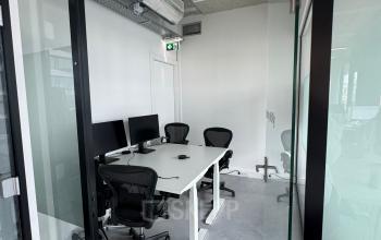Modern office space to rent at Moermanskkade 303, Amsterdam Houthavens with minimalist design and ergonomic chairs around a meeting table.