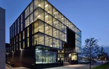 Exterior of office building located at Archangelkade 9, Amsterdam Houthavens, Amsterdam with large windows and modern architectural design.