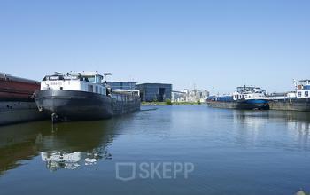Waterfront view with boats docked near office space at Archangelkade 9, Amsterdam Houthavens.
