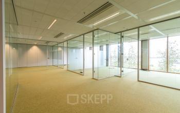 Spacious, unfurnished office space with glass partitions at Pedro de Medinalaan 1-9 1-9 in Amsterdam IJburg, suitable for office space rental.