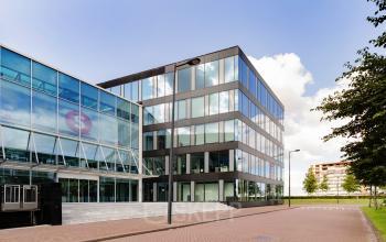 Exterior view of a modern office building at Pedro de Medinalaan 1-9, Amsterdam IJburg, available for office space rental.