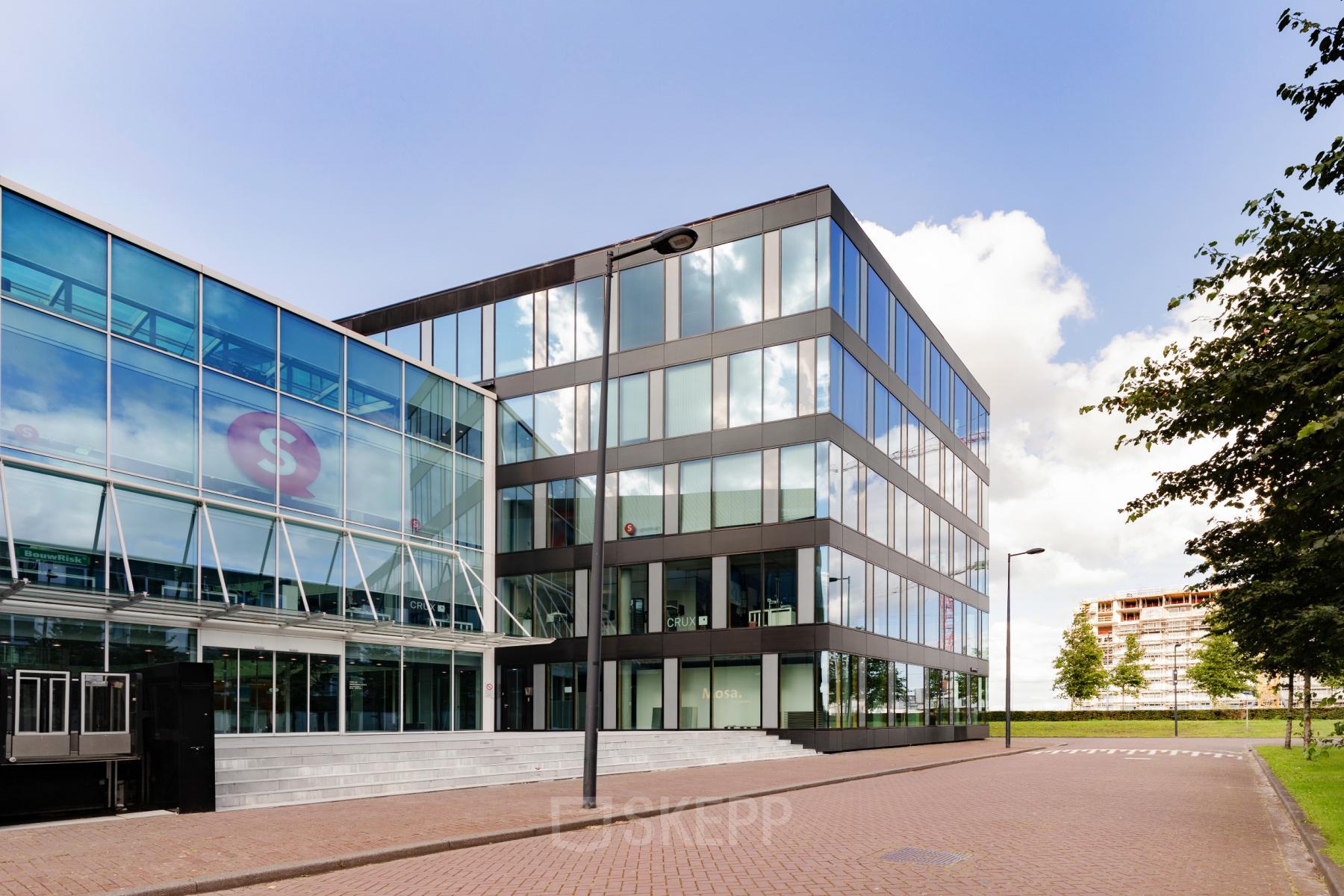 Exterior view of a modern office building at Pedro de Medinalaan 1-9, Amsterdam IJburg, available for office space rental.
