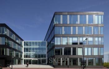 Exterior view of office building at Pedro de Medinalaan 7, Amsterdam IJburg, showcasing modern architecture perfect for office space rental.