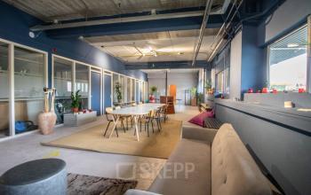 Modern office space for rent at Anthony Fokkerweg 3, Amsterdam Nieuw-West, featuring stylish furnishings, open work areas, and large windows for natural light.