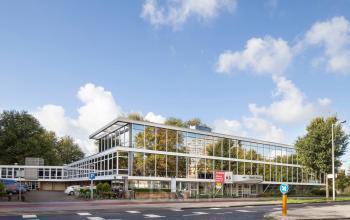 Exterior view of the office building for rent at Baden Powellweg 283/305, Amsterdam New-West, with large windows and modern architecture.
