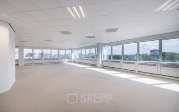 Spacious, well-lit, open-plan office to rent at Overschiestraat 61 in Amsterdam New-West, with large windows and ample natural light.