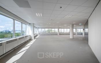 Bright and spacious office to rent at Overschiestraat 61, Amsterdam New-West, featuring large windows with ample natural light and an open layout.