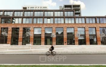 Exterior view of the office building at Papaverhof 58 in Amsterdam North, showcasing a modern facade. Ideal for those seeking office space rental in a prime location.