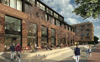 Exterior view of Papaverhof 58 in Amsterdam North, showcasing a lively public area with people enjoying the outdoor seating, ideal for businesses seeking an inviting entrance. Perfect location for rent office space.