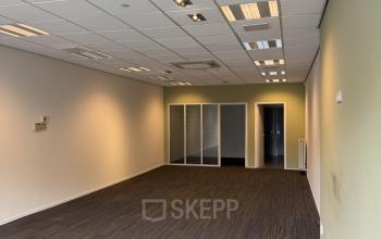 Unfurnished office space available for rent at Buikslotermeerplein 430, Amsterdam North. Spacious interior with large windows, suitable for customizable office space rental needs.