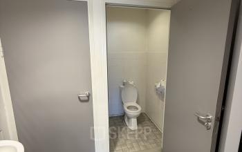 Interior view of a restroom with a toilet and sink, suitable as a part of office space rental at Buikslotermeerplein 430, Amsterdam North.