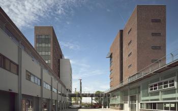 Modern office space rental at Asterweg 19 in Amsterdam Noord, showcasing a sleek exterior with ample natural light.