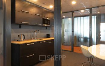 Modern office space rental at Asterweg 19, Servicepunt Kaap Noord, featuring a well-equipped kitchenette in Amsterdam North.