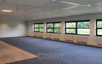 Spacious unfurnished office interior at Science Park 301, Amsterdam East, offering ample natural light and versatile layout for office space rental.