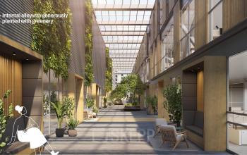 Interior photo of office space at Jacob Bontiusplaats 9, Amsterdam East, featuring a green alleyway with plants, seating, and natural light, ideal for office space rental.